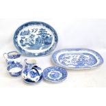 A collection of blue and white ceramics including meat plates, jugs, tea cups and saucers, etc.