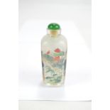 A Chinese inside painted glass snuff bottle of square tapering form depicting figural garden scene