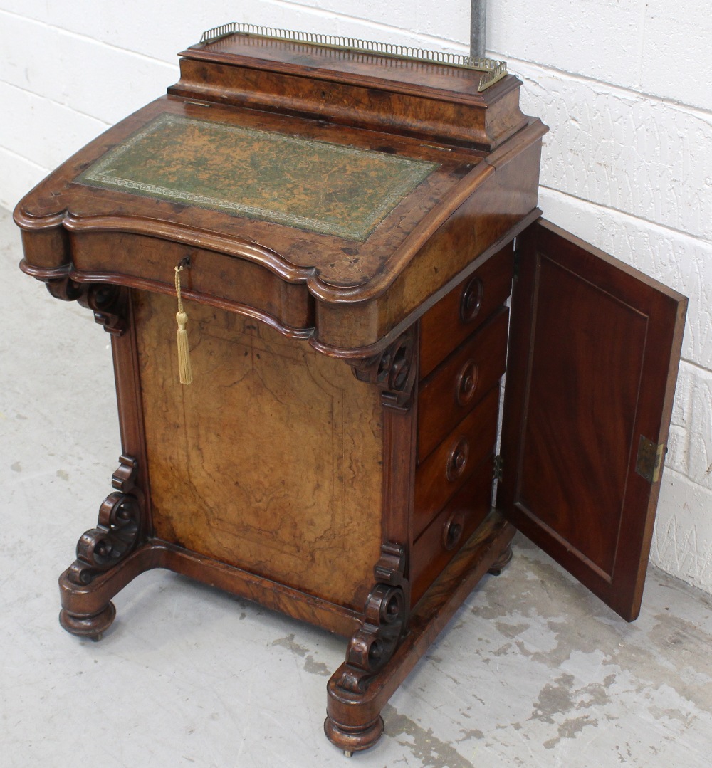 A late Victorian walnut Davenport desk with galleried top box above a maple-lined fall-flap with
