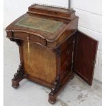 A late Victorian walnut Davenport desk with galleried top box above a maple-lined fall-flap with