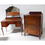 A 1930s walnut chest of four drawers with blind fretwork galleried back and short cabriole legs and