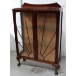 An early-to-mid 20th century mahogany display cabinet with sunburst design to double glazed doors,