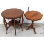 An early 20th century mahogany table with lower shelf on tapering cabriole supports and an Italian