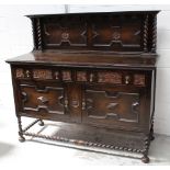 An early-to-mid 20th century oak Jacobethan-style dresser with two drawers over two cupboards