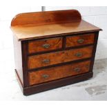 An Edwardian two-over-two chest of drawers to bracket supports and castors, height 90cm,