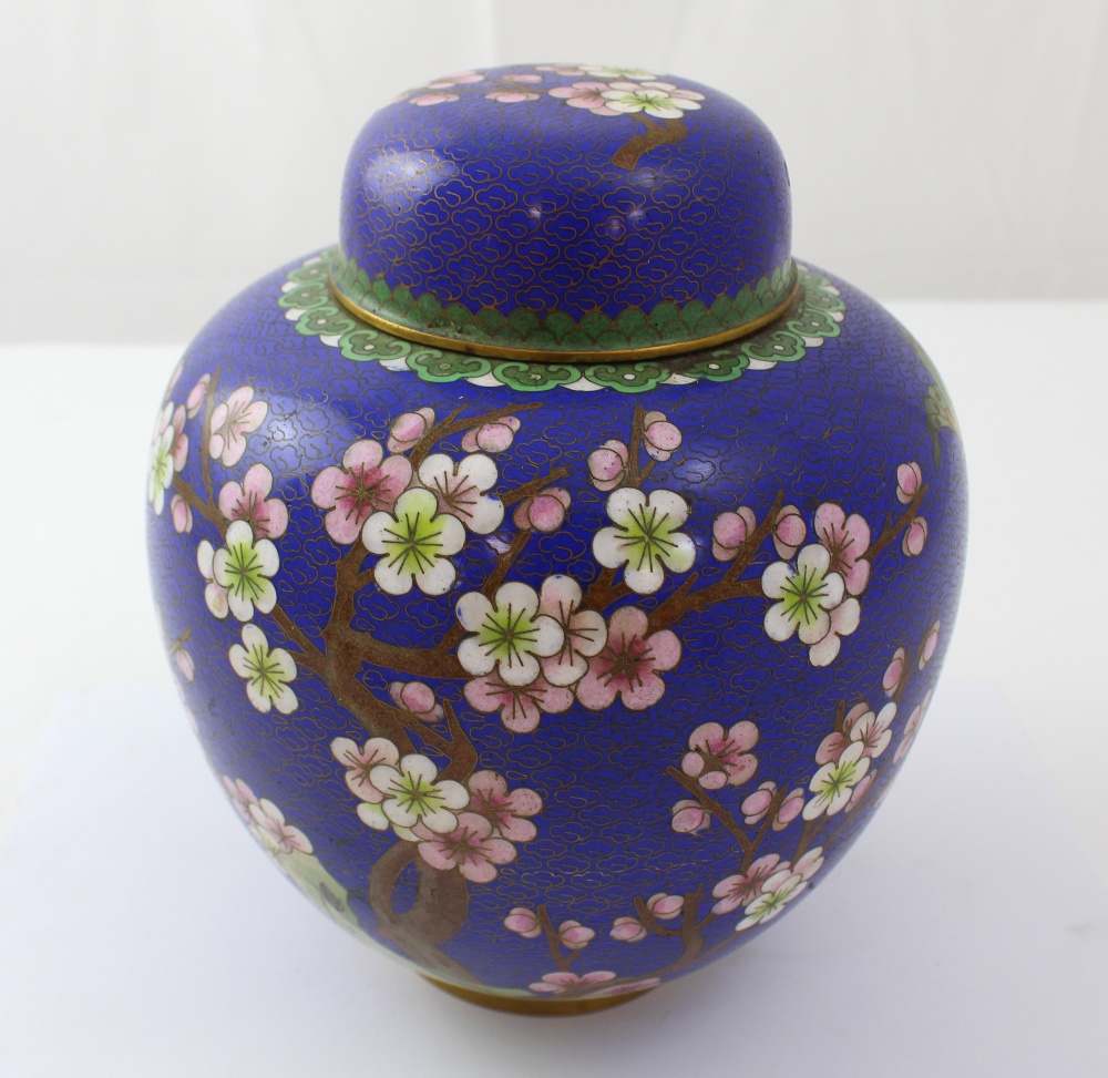 A mid-to-late 20th century Japanese cloisonné blue ground ginger jar and cover decorated with