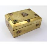 A Chinese brass box with hinged lid and circular cartouche enamel and brass relief decoration,