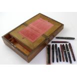 A Victorian walnut ladies' writing slope and a quantity of vintage pens to include a Conway Stewart