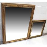 An ornate gilt-framed rectangular bevelled wall mirror,