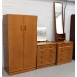 A mid-20th century bedroom suite comprising two-door wardrobe, a four-drawer dressing chest,