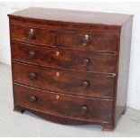 A Victorian mahogany bow-front chest of two-over-three drawers with knob handles,