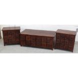 A low tropical hardwood multi-drawer cabinet and a pair of tropical hardwood twelve-drawer side