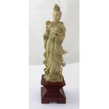 An early 20th century Chinese carved soapstone figure, height 34cm.