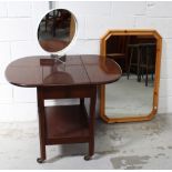 A mid-20th century mahogany drinks cabinet with drop leaves to either side over a shelf,