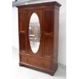 An Edwardian mahogany inlaid single-door wardrobe,