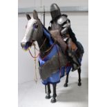 A full-size Fibreglass armoured horse and mounted knight, with bridlery and lance,