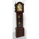 A modern reproduction oak longcase clock with rolling moon, Roman dial, striking on the quarter,