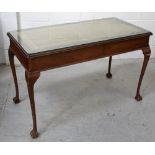 A reproduction console table with inlaid leather top to tapering cabriole supports and ball and