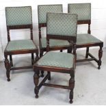 A set of four 1930s Puritan-style dining chairs with upholstered backs and drop-in seats,