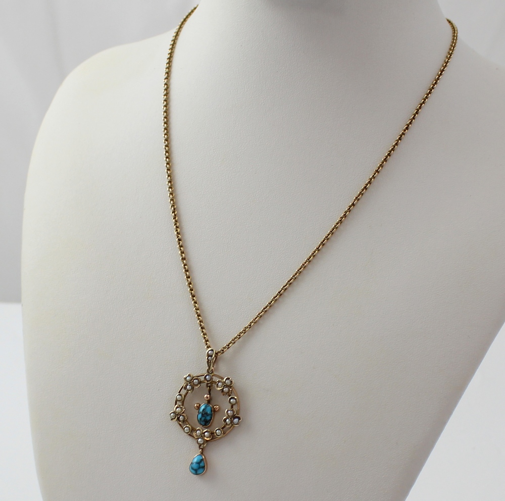An Edwardian 9ct gold circular pendant set with turquoise and seed ...