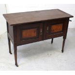 A Victorian wash stand, marble top above two cupboard doors to turned tapering supports on castors,