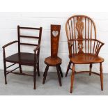 A light elm Windsor chair with crinoline stretcher,