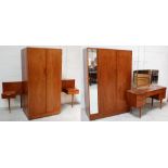 A retro teak bedroom suite comprising two matching twin-door wardrobes;