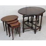 An early-to-mid 20th century oak gate-leg table on wrythen supports and cross stretchers,