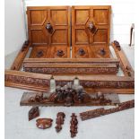 A quantity of various walnut cornices, mouldings and cupboard doors,