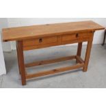 A contemporary pine console table, two frieze drawers to block supports and stretchers,