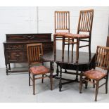 An early-to-mid 20th century oak and beech dining suite comprising a set of four Arts and Crafts