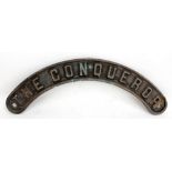 A small train or railway shed curved name plate, with raised lettering 'The Conqueror', length 41cm.