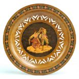 A Sorento circular plate depicting a dancing couple within pierced border, diameter 27cm.