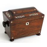 A rosewood and mother of pearl inlaid sarcophagus form tea caddy with two division twin lidded