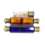 Two Victorian Bristol Blue and amber faceted glass double scent bottles with base metal hinged caps,