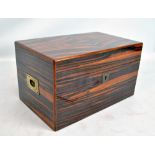 A Davidoff coromandel veneered humidor, with label to interior and campaign style handles, 19 x 33.