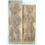 A pair of Dutch pine pastry boards, each decorated with stylised figures, lengths 89.