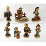 Seven Hummel figures to include a young boy cobbler,