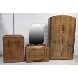 An oak three-piece bedroom suite comprising wardrobe, tallboy and dressing table (3).