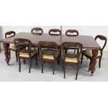 A late 19th/early 20th century mahogany wind-out dining table on turned baluster supports to