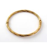 A 9ct gold rope twist bangle with hinge and clasp, approx 4.5g.