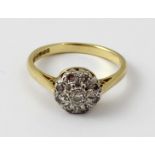 An 18ct yellow gold diamond illusion-set rose cluster, size N 1/2, approx 4g.