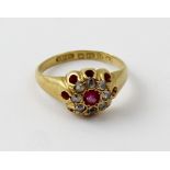 An 18ct gold ladies' dress ring, floral-set with central red stone and white stones, size G,