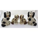 Two pairs of 19th century Staffordshire dogs; one pair with free-standing front leg (2).