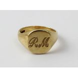 A gentlemen's 9ct gold signet ring, initials to top 'R.M.', size U, approx 7.9g.