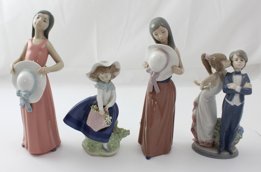 Four Lladró figures; two young ladies with large bonnets,