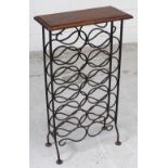 A wrought iron wine rack with stained wooden table top, height 87cm.