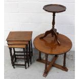 A nest of three oak tables on turned supports,