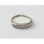 A 9ct white gold half eternity ring set with seven simulated diamonds, size N 1/2, approx 1.7g.