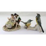 A pair of yellow tits on a branch (af) with blue marks to base and a Continental porcelain figural